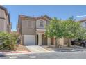 Charming home featuring desert landscaping, a two-car garage, and neutral-toned exterior at 589 Brinkburn Point Ave, Las Vegas, NV 89178