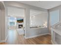 Open-concept living room area features a fireplace, comfortable seating, and tons of natural light at 6056 Atlantis Dream Ave, Las Vegas, NV 89139