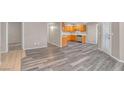 Spacious living area showcases wood-look floors and connects to the kitchen at 701 Capri Dr # 6A, Boulder City, NV 89005