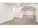 Open layout living space with ceiling fan, recessed lighting, and archways at 9006 Cedar Door Ave, Las Vegas, NV 89148