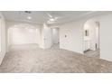 Spacious main bedroom with neutral carpet, ceiling fan, and en-suite bathroom at 9006 Cedar Door Ave, Las Vegas, NV 89148