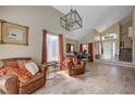 Spacious living room with vaulted ceilings, large windows, and stylish decor at 9333 Dry Dock Dr, Las Vegas, NV 89117