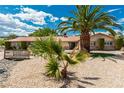 Beautiful home featuring desert landscaping, mature palm trees, and an inviting front entrance at 9660 W Ann Rd, Las Vegas, NV 89149