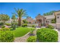 Attractive single-story home featuring a manicured front yard with desert landscaping and a courtyard entry at 2225 Blackburn Hills Ave, Henderson, NV 89044