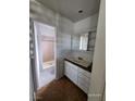 Bathroom featuring a vanity with granite countertop and a tiled shower at 3112 Piedmont Ave, Las Vegas, NV 89102