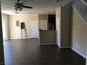 Spacious living room with tile floors, connecting seamlessly to the kitchen area at 3175 Obscured Light Walk, Henderson, NV 89044
