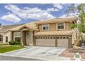 Beautiful two-story home with a spacious driveway and a three-car garage at 3692 River Canyon Rd, Las Vegas, NV 89129