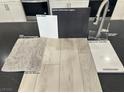 Kitchen design sample featuring white quartz countertops, gray cabinets, and stainless steel faucet at 4205 Mount Bonnell Ave, North Las Vegas, NV 89081