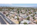 An aerial view shows the neighborhood surrounding the property with lush landscaping at 4516 E Flamingo Rd, Las Vegas, NV 89121