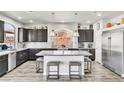Beautiful kitchen with granite countertops, stainless steel appliances, and dark wood cabinets at 5976 Rockway Glen Ave, Las Vegas, NV 89141
