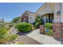 Inviting home with manicured landscaping, desert rock accents, and a secure entrance at 905 Star Pine Dr, Las Vegas, NV 89144