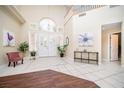 Bright foyer with high ceilings, decorative tile flooring, and elegant double doors at 9660 Drayton Ave, Las Vegas, NV 89148
