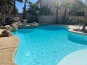 Sparkling blue pool with rock features and a refreshing oasis vibe at 10 Gulf Pines Ave, Las Vegas, NV 89148