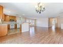 Open-concept kitchen and living area with lots of natural light at 11577 Vesuvio Ct, Las Vegas, NV 89183