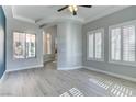 Bright living room with hardwood floors, plantation shutters, and abundant natural light showcasing the home's inviting atmosphere at 12116 Vista Linda Ave, Las Vegas, NV 89138