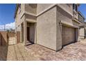 Charming two-story home featuring a brick driveway and stucco exterior at 1611 Prairie Fields Ct, Las Vegas, NV 89115
