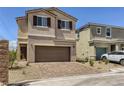 Charming two-story home with a two car garage and manicured front yard landscaping at 1611 Prairie Fields Ct, Las Vegas, NV 89115