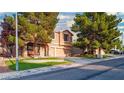 Attractive two-story home with a neatly landscaped front yard and a spacious driveway at 268 Copper Glow Ct, Henderson, NV 89074