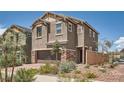 Charming home with a two-car garage, landscaped front yard, and well-maintained exterior at 363 Silva Pl, Henderson, NV 89011