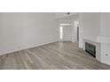Open living area with fireplace and newly installed floors at 5155 W Tropicana Ave # 2095, Las Vegas, NV 89103