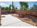 Spacious backyard with concrete patio, perfect for outdoor entertaining and relaxation at 5216 Loma Verde Ave, Las Vegas, NV 89108