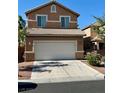 Two-story home featuring a two-car garage, neutral stucco siding, and a well-maintained front yard at 5216 Loma Verde Ave, Las Vegas, NV 89108