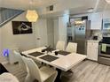 View of the kitchen and dining area, featuring stainless steel appliances at 5474 S Maryland Pkwy, Las Vegas, NV 89119