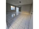 Bright living room with ceramic tile flooring and abundant natural light at 5615 Blue Sea St, Las Vegas, NV 89110