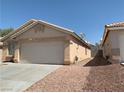 Charming single-story home with a two-car garage and gravel landscaping at 6470 Shining Sand Ave, Las Vegas, NV 89142
