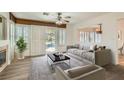 Cozy living room showcasing a fireplace, comfortable seating, and access to the backyard pool at 697 Gull Point Ave, Las Vegas, NV 89123