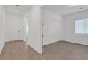 Bright bedroom features tile floors and a sliding door closet, providing ample storage space at 701 Webber Park St, Henderson, NV 89011
