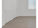 Close up view of a bedroom with tiled floors and a double door closet at 701 Webber Park St, Henderson, NV 89011