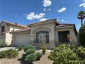 Inviting home with a tile roof, two-car garage, and drought-resistant landscaping for easy maintenance at 8337 Ruby Heights Ave, Las Vegas, NV 89117