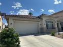 Well-maintained home featuring a two-car garage, tile roof, and easy to care for front yard at 8337 Ruby Heights Ave, Las Vegas, NV 89117