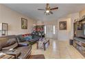 Inviting living room featuring tile floors and plenty of seating at 9091 Jumping Jacks Ave, Las Vegas, NV 89178