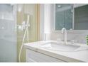 Elegant bathroom features a modern sink, quartz countertops, and a sleek, glass-enclosed shower at 9813 Folsom Dr, Las Vegas, NV 89134