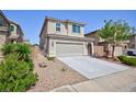 Attractive home featuring desert landscaping, a two-car garage, and private entry at 1037 Water Cove St, Henderson, NV 89011