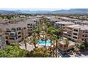 An aerial view of the community showcases the pool, landscaping, and the surrounding neighborhood at 120 Los Cabos Dr # 301, Las Vegas, NV 89144