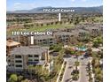 A view of 120 Los Cabos Dr near the TPC Golf Course, pool, landscaping, and the surrounding neighborhood at 120 Los Cabos Dr # 301, Las Vegas, NV 89144