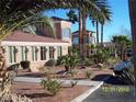 Attractive exterior with desert landscaping, palm trees and a tile roof at 3318 N Decatur Blvd # 2077, Las Vegas, NV 89130