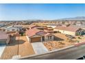 Aerial view of a charming single-story home nestled in a well-planned community at 3665 E Garfield Dr, Pahrump, NV 89061