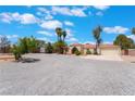 Single-story home with desert landscaping, a sprawling gravel lot, and a quaint front entryway at 4530 W Shelbourne Ave, Las Vegas, NV 89139