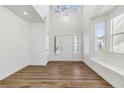 Bright and airy living room with vaulted ceiling, hardwood floors, and natural light at 5228 Shasta Lake Way, Las Vegas, NV 89118