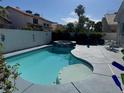 Inviting backyard pool with a spa and outdoor dining area, perfect for relaxation and entertainment at 7416 Alcove Glen Ct, Las Vegas, NV 89129