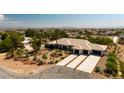 Expansive aerial view showcases the well-maintained property, mature landscaping, and the home's layout at 8290 Gagnier Blvd, Las Vegas, NV 89113
