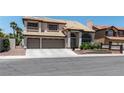 Spacious two-story home with tile roof, front yard landscaping, and attached three-car garage at 8820 Fall Green Ave, Las Vegas, NV 89129
