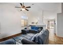 Bright living room featuring vaulted ceilings, ceiling fan, and lots of natural light at 218 Red Coral Dr, Henderson, NV 89002