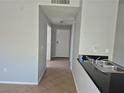 Clean open kitchen area with granite countertop and tile floors at 2900 Sunridge Heights Pkwy # 418, Henderson, NV 89052