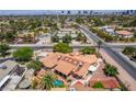 Aerial view of home with lush landscaping, swimming pool and proximity to the Las Vegas Strip at 3085 Duneville St, Las Vegas, NV 89146