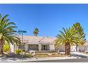 Charming home with desert landscaping, palm trees, and a well-maintained front yard at 3101 Hayden Ct, Las Vegas, NV 89134